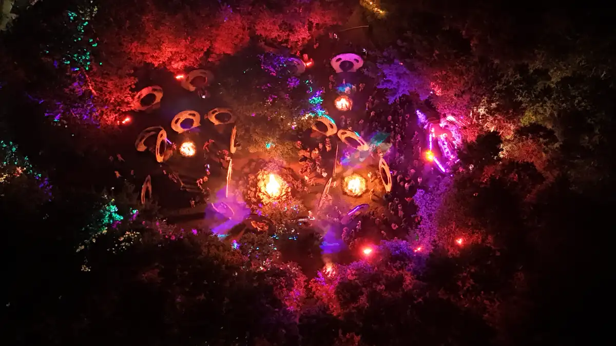 Drone at night of fire and red lit area below