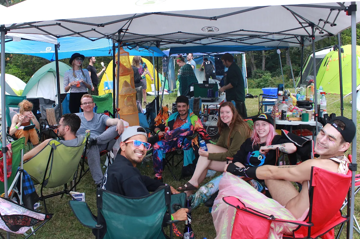 Group with tents under market tent