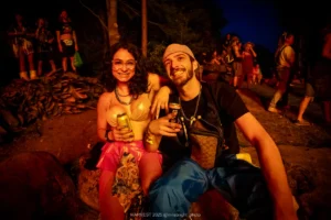 HARVEST 2025, @milabright_photo-3812 Happy couple at an outdoor festival at night, holding drinks