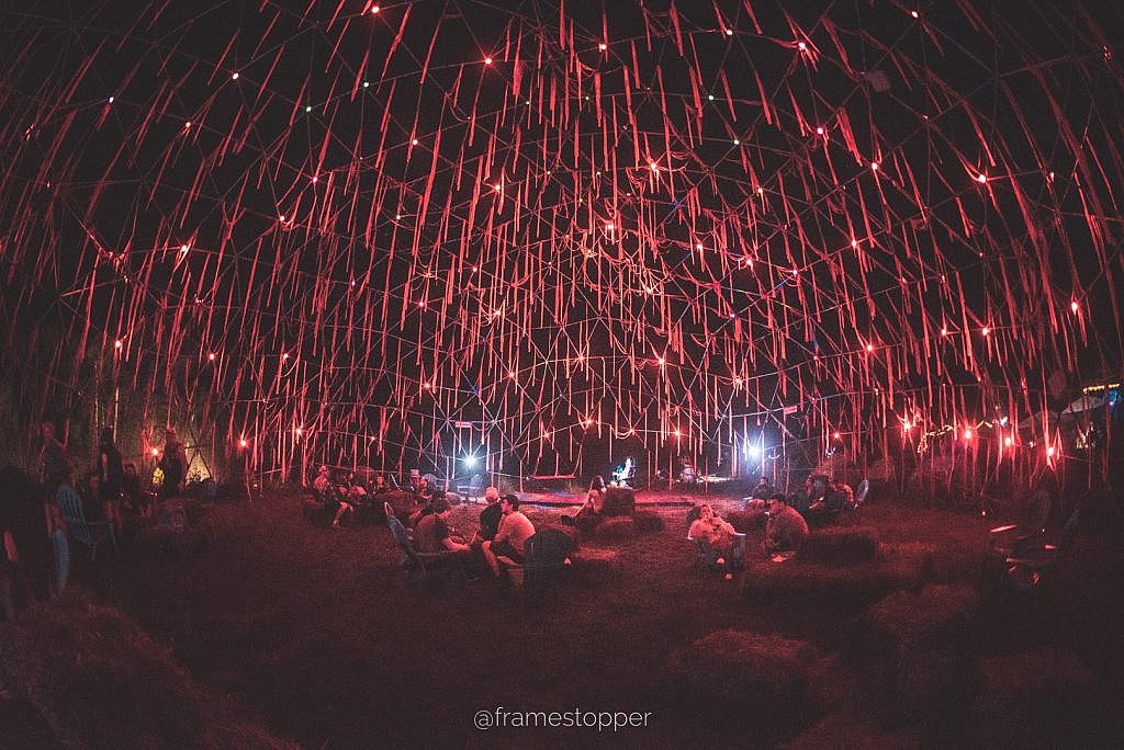 Crash structure lit with red streamers