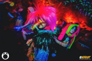 man-with-wild-wig-by-zac-mac Pink haired dancer with long nose mask