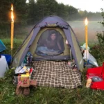 Woman in tent with candles
