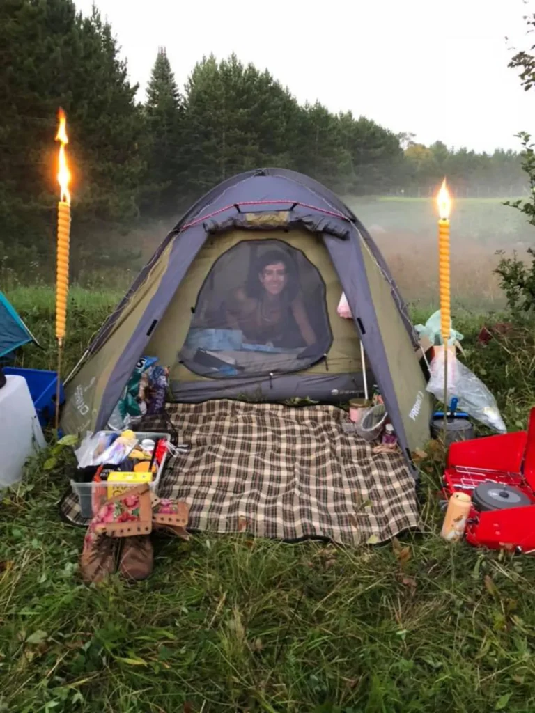 Woman in tent with candles